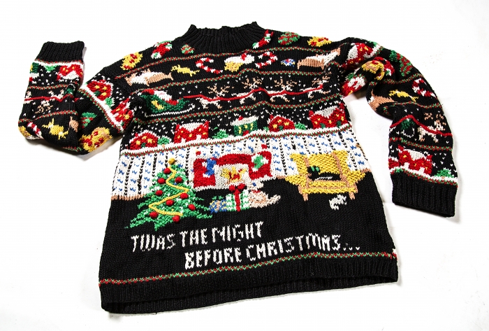 black Christmas sweater with holiday quote